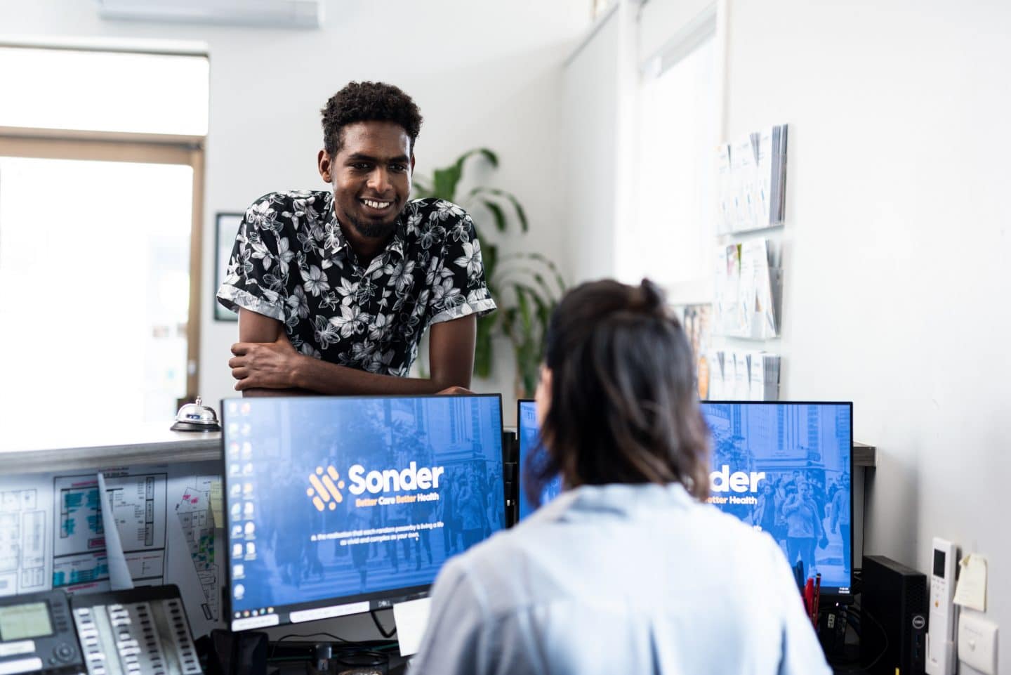 Sonder Receptionist welcoming Client
