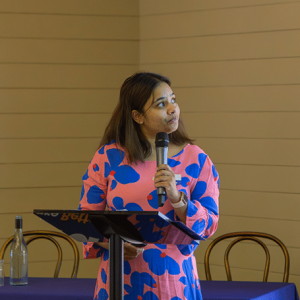 Woman holding microphone.
